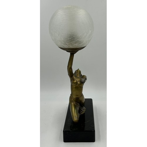 1012 - An Art Deco style figural table lamp, modelled in the form of a lady atop a marble type base. 47cm t... 