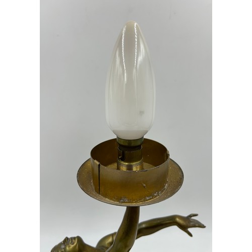 1012 - An Art Deco style figural table lamp, modelled in the form of a lady atop a marble type base. 47cm t... 