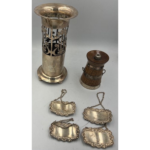 799 - Four silver decanter labels, silver bound oak pepper pot and a silver plated Art Nouveau vase.