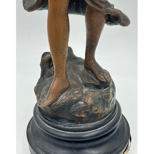 1303 - A late 19thC Spelter Figurine Charmeuse by R. Richard depicting a woman with two doves. 44cm h.