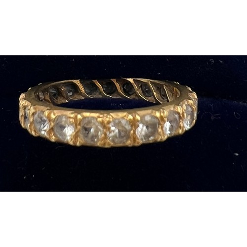 614 - An 18 carat gold ring set with clear stones, marked syn spin. Size N. Weight 2.8gm.