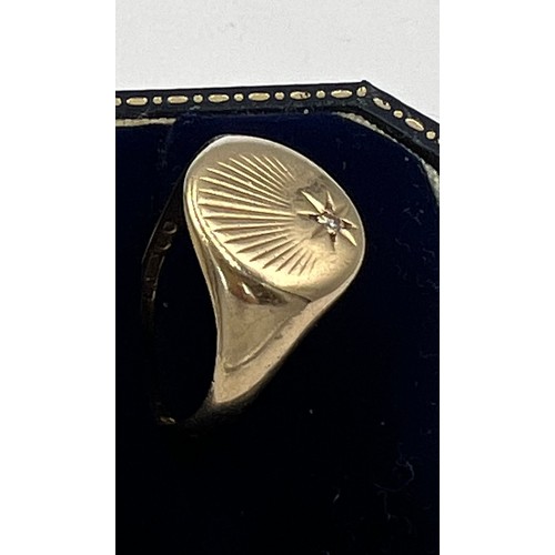 608 - A nine carat gold signet ring set with single diamond. Size V. Weight 4.2gm.