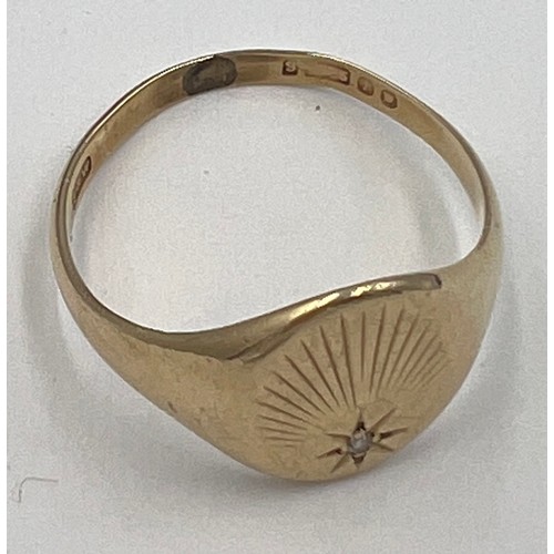 608 - A nine carat gold signet ring set with single diamond. Size V. Weight 4.2gm.