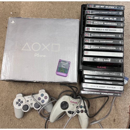 1213 - A boxed PlayStation One games console with games including Medal of Honor, Command & Conquer, The Wo... 