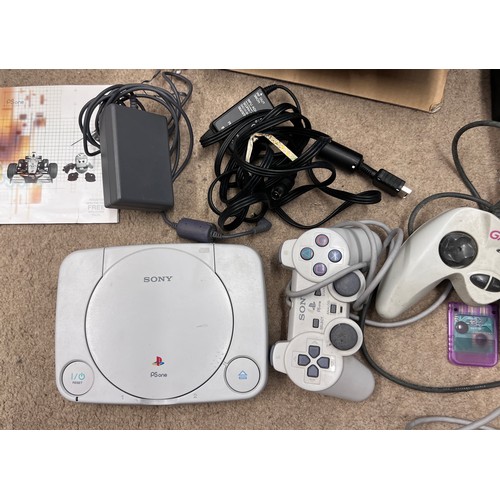 1213 - A boxed PlayStation One games console with games including Medal of Honor, Command & Conquer, The Wo... 