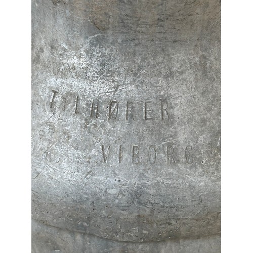 32 - Two twin handled galvanised Danish milk churns to include a Trifolet Tilhorer made in Viborg dated 1... 