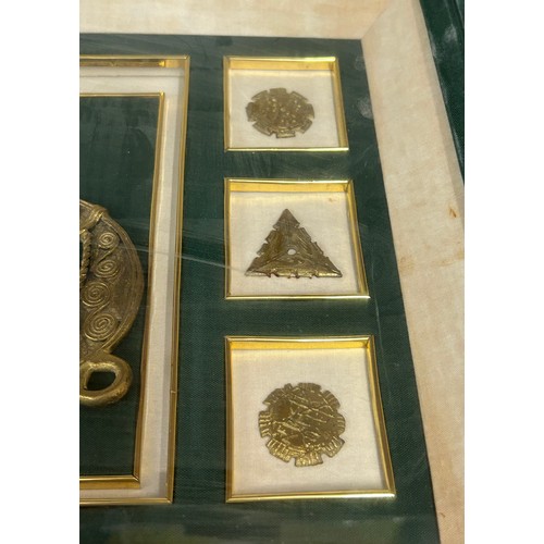 926 - Two framed cases containing Nigerian fasteners and comb together with three Nigerian books ' An Intr... 