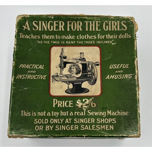 1307 - A Child's Singer Sewing Machine - 'A singer For The Girls. Teaches them to make clothes for their do... 