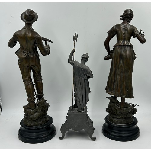 1310 - Three late 19thC Spelter figurines to include Man with sickle 50cm h, Woman with sickle 'Surprise' 5... 