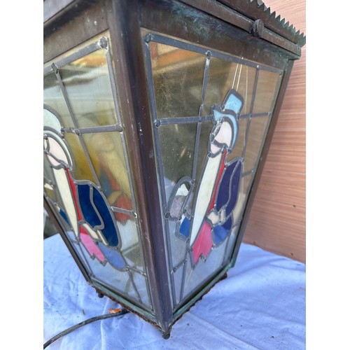 1010 - A stained glass William Younger pub wall light/lantern. 43cm x 43cm x 77cm h.