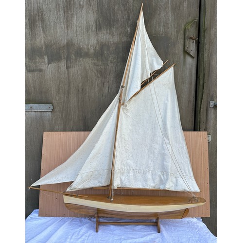 1312 - A wooden scale model of a pond yacht 117cm l x 17cm d x 150cm h.