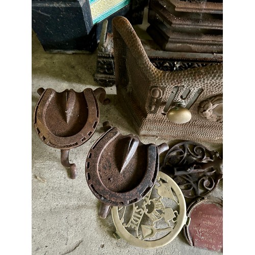 39 - A Victorian cast iron fireplace with tiled insert together with trivets, fender, early 20thC racehor... 