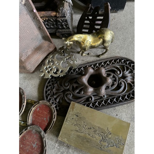 39 - A Victorian cast iron fireplace with tiled insert together with trivets, fender, early 20thC racehor... 