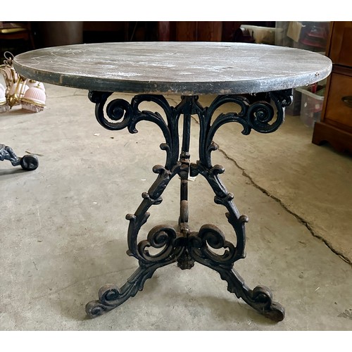 40 - A 19thC cast iron pub table with wooden circular top. 76cm d.