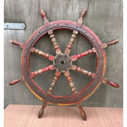 1314 - A heavy vintage ship’s wheel. 100cm d.