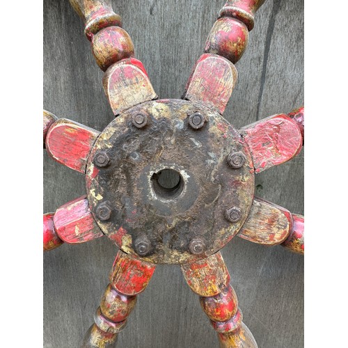 1314 - A heavy vintage ship’s wheel. 100cm d.