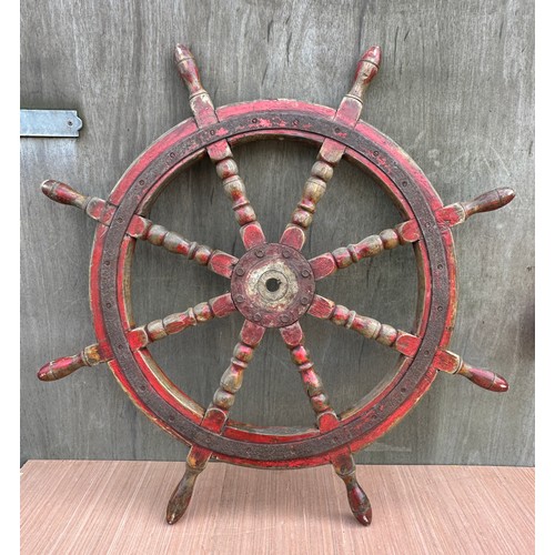 1314 - A heavy vintage ship’s wheel. 100cm d.