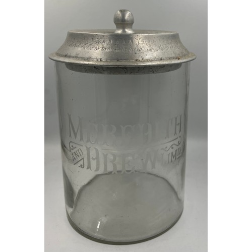 1354 - A vintage glass and metal biscuit container from Meredith and Drew Limited. Company name etched into... 