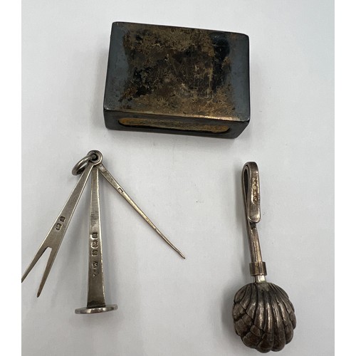 788 - Silver tobacco tamper Birmingham 1900, maker GE Walton & Co Ltd, silver napkin holder and a silver m... 