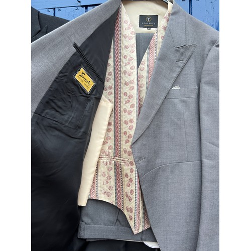 858 - Two vintage gentleman’s tail suits both with waistcoats and trousers together with a grey felt top h... 