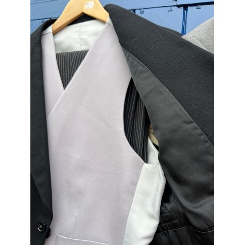 858 - Two vintage gentleman’s tail suits both with waistcoats and trousers together with a grey felt top h... 