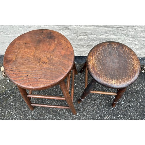 139 - Two wooden stools. Tallest 60cm.