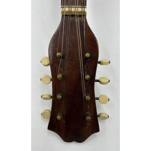 982 - An early 20thC Mandolin by Carlo Ricordo Naplois No. 1008 with original case.