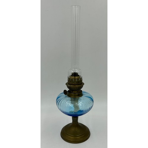 1016 - Two French Glass Bowl shaped Oil Lamps with brass bases. blue lamp 27cm to wick/49cm with funnel etc... 