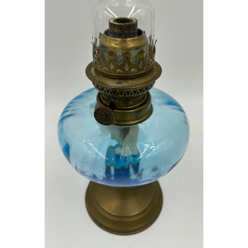 1016 - Two French Glass Bowl shaped Oil Lamps with brass bases. blue lamp 27cm to wick/49cm with funnel etc... 