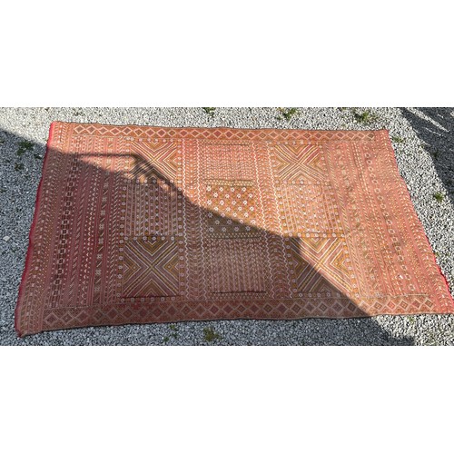 1219 - A hand woven wool rug approximately 170cm x 327cm.