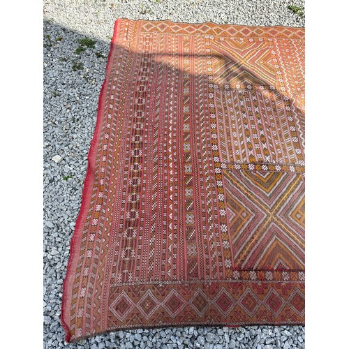 1219 - A hand woven wool rug approximately 170cm x 327cm.