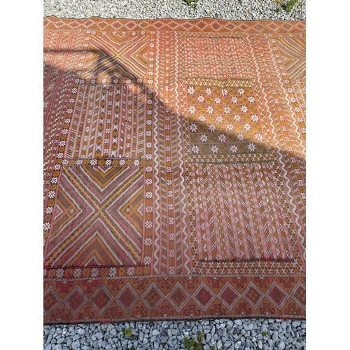 1219 - A hand woven wool rug approximately 170cm x 327cm.