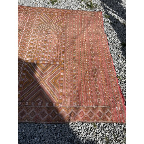 1219 - A hand woven wool rug approximately 170cm x 327cm.