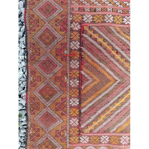 1219 - A hand woven wool rug approximately 170cm x 327cm.