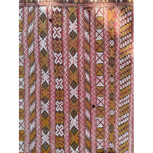 1219 - A hand woven wool rug approximately 170cm x 327cm.