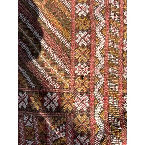 1219 - A hand woven wool rug approximately 170cm x 327cm.