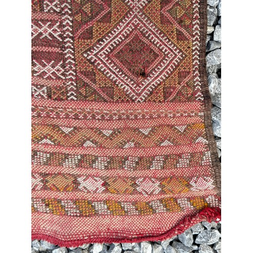 1219 - A hand woven wool rug approximately 170cm x 327cm.