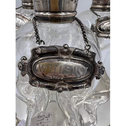 790 - Three silver necked decanters Birmingham 1905, maker Elkington & Co. Ltd together with three silver ... 