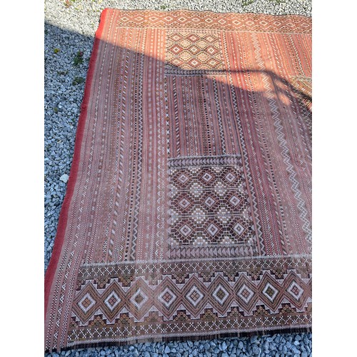 1218 - A large hand woven wool rug approximately 353cm x 234cm.