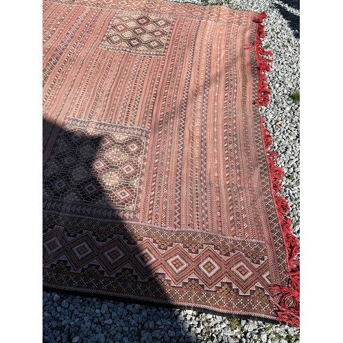 1218 - A large hand woven wool rug approximately 353cm x 234cm.