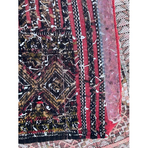 1218 - A large hand woven wool rug approximately 353cm x 234cm.