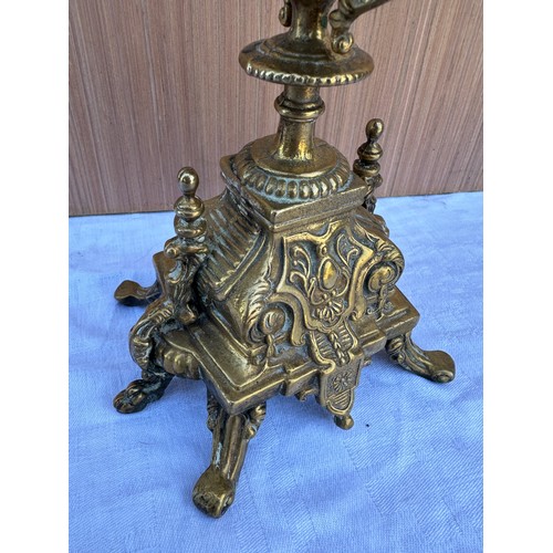 1015 - Two decorative three branch wall lights 54cm h together with two brass candelabras 42.5cm h. One loo... 