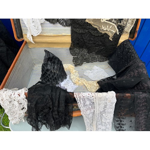 865 - A large quantity of mainly 19thC lace, collars and blouses, together with a vintage leather and canv... 