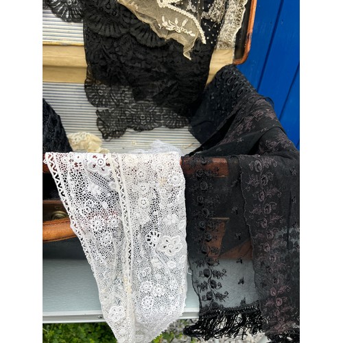 865 - A large quantity of mainly 19thC lace, collars and blouses, together with a vintage leather and canv... 