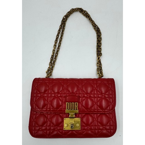 880 - A Christian Dior Cannage 'Dior Addict' leather bag in red. Gold chain and gold fittings. Suede inter... 