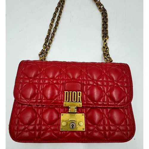 880 - A Christian Dior Cannage 'Dior Addict' leather bag in red. Gold chain and gold fittings. Suede inter... 