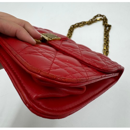 880 - A Christian Dior Cannage 'Dior Addict' leather bag in red. Gold chain and gold fittings. Suede inter... 