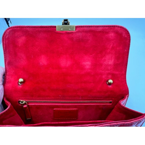 880 - A Christian Dior Cannage 'Dior Addict' leather bag in red. Gold chain and gold fittings. Suede inter... 