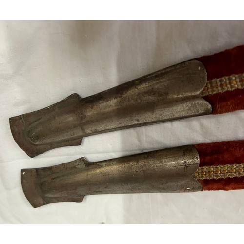 922 - Two Indian dress swords marked Golden Temple made in India, in velvet sheaths both measuring 97cm.