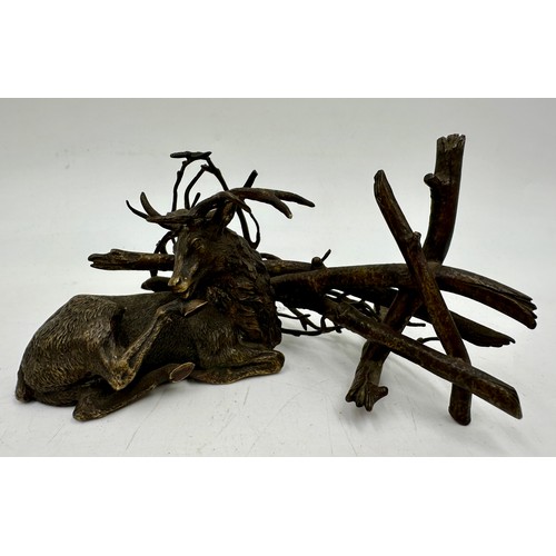 1322 - A miscellany to include a bronze figure of a stag against a fence and branch, indistinct marks to ba... 